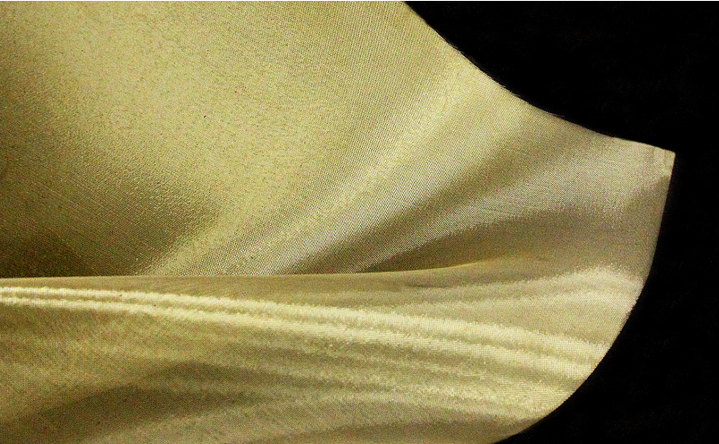 Photo of mesh with a golden sheen after vapor deposition
